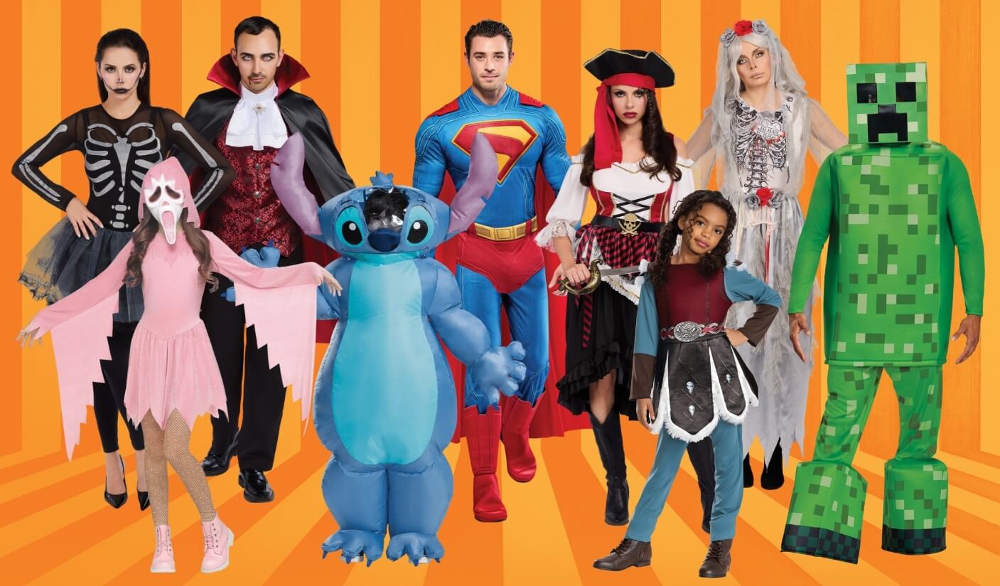 Group of adults and children dressed in colorful Halloween costumes, including a skeleton, vampire, superhero, pirate, ghost, Stitch, bride, and Minecraft character, standing in front of an orange striped background